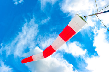 blue sky and striped windsock