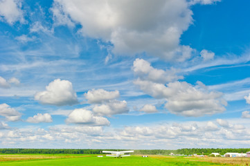 Rural plane on the runway in a field