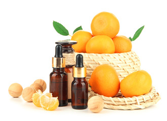 Tangerine essential oil and tangerines, isolated on white