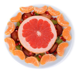 Sweet fresh fruits on plate isolated on white