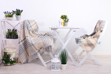 Garden chairs and table with flowers