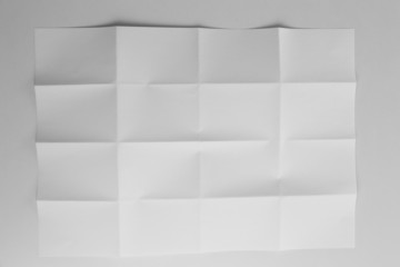 Folded white sheet of paper close up