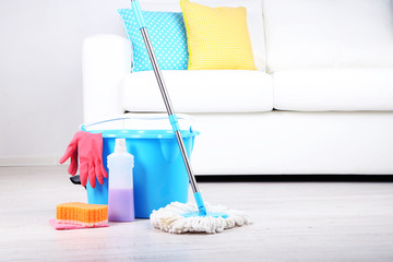 Floor mop and bucket for washing in room © Africa Studio