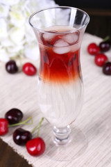 Glass of cocktail on table close-up