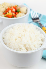 Cooked rice and vegetables close up