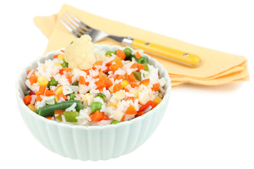 Cooked rice with vegetables isolated on white
