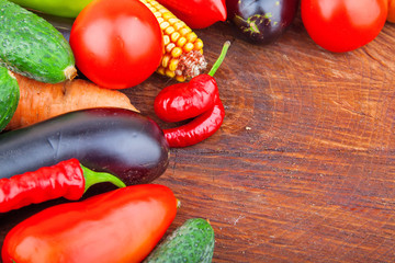 Autumn fresh vegetables on wooden background, food photo