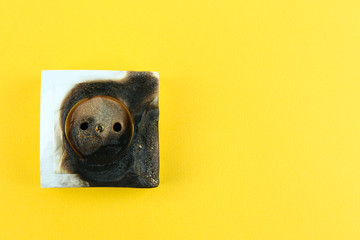 Burned plug socket close up
