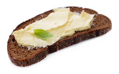Slice of rye bread with butter, isolated on white