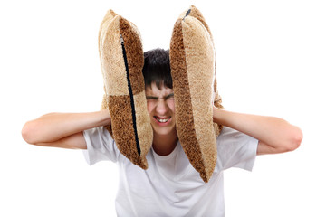 Displeased Teenager with Cushion