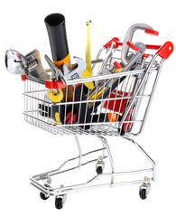 Construction tools in shopping cart isolated on white