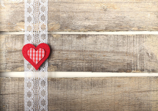 Red heart on old wooden background