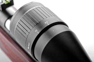 Rifle closeup on a white background with a telescopic sight