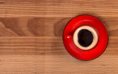 Red cup of coffee top view