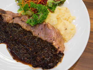 Sirloin steak with sauce