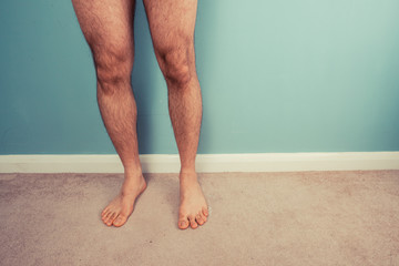 Bare legs of a man - Powered by Adobe