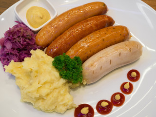 Grilled sausages with vegetables and mashed potatoes