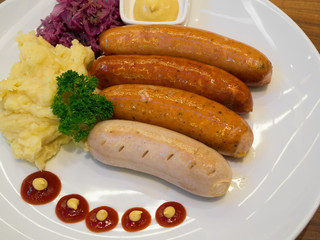 Grilled sausages with vegetables and mashed potatoes