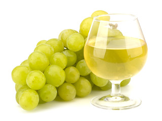 Green grape bunch and glass on wine isolated on white background