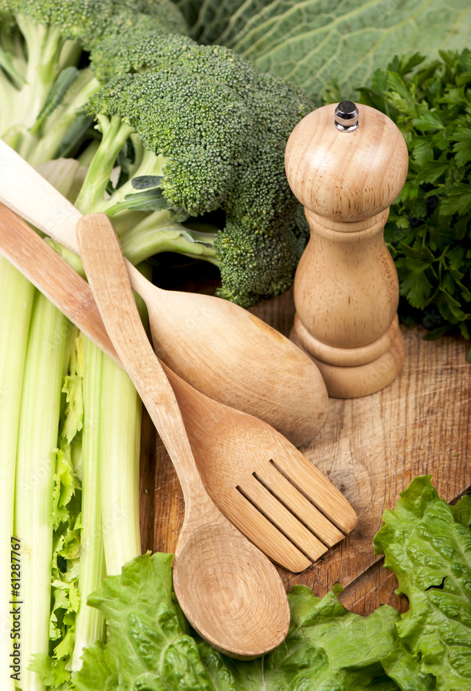 Wall mural fresh vegetables on the wooden background and paper for notes