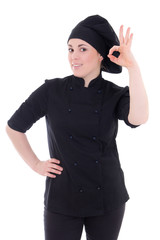 attractive cook woman in black uniform showing ok sign isolated