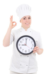 portrait of young cook woman in uniform with clock showing ok si