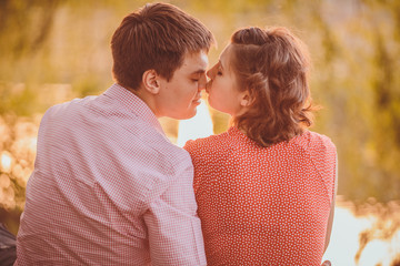 Portrait of young couple in flowering park