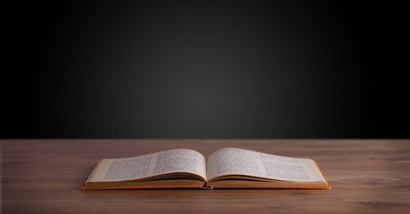Open book on wooden deck