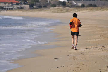 man running in the beach