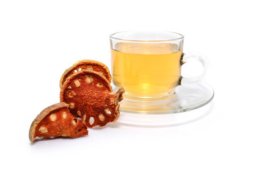 a cup of hot bael fruit juice on white background