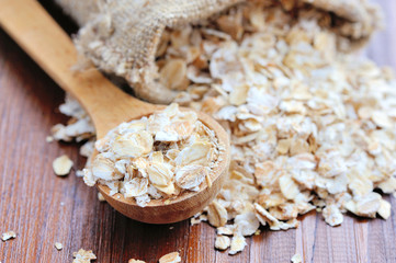 Oat flakes on wooden table