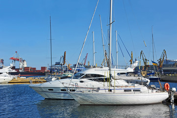 White motor yacht over harbor pier, Odessa, Ukraine