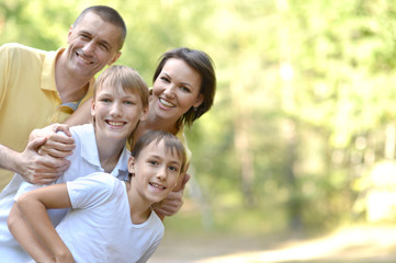 Happy family in the summer park
