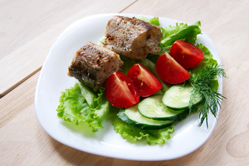 Fried fish with salad