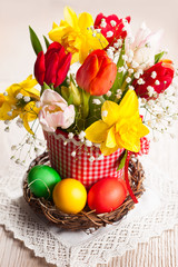 Fototapeta na wymiar Spring flowers and Easter eggs