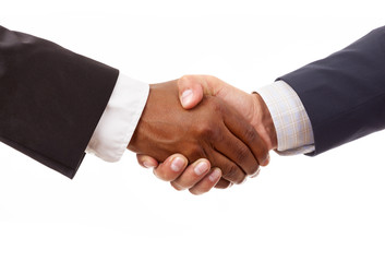 Handshake between african and a caucasian business man, isolated