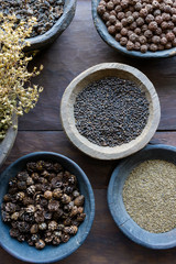 Herbs and spices in bowls used in Ayurvedic medicine