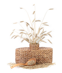 Fototapeta na wymiar Wicker vase with wheat ears.