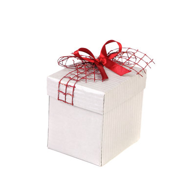 White gift box with red ribbon bow.