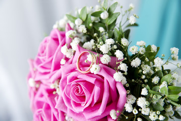 Wedding rings and bouquet
