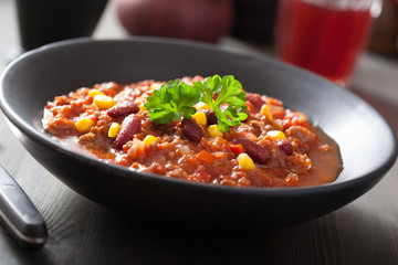 mexican chili con carne in black plate