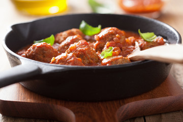 meatballs with tomato sauce in black pan