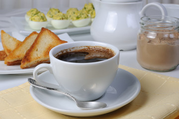 Cup of coffee with toast and a can  pate