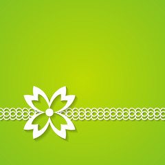 green background with a lace and a flower