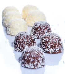 Chocolate candies with coconut flakes
