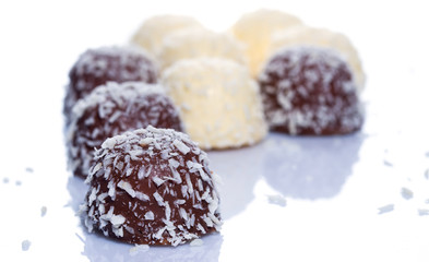 Chocolate candies with coconut flakes