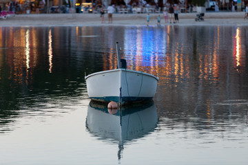 Obraz premium Beautiful Sunset scene with a small boat