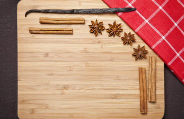 Naklejka premium Cinnamon sticks, brown sugar, anise stars and vanilla beans