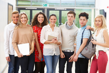 Fototapeta premium Portrait Of Female Tutor In Class With Students