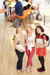 Overhead Shot Of Female Students Standing In Cafeteria